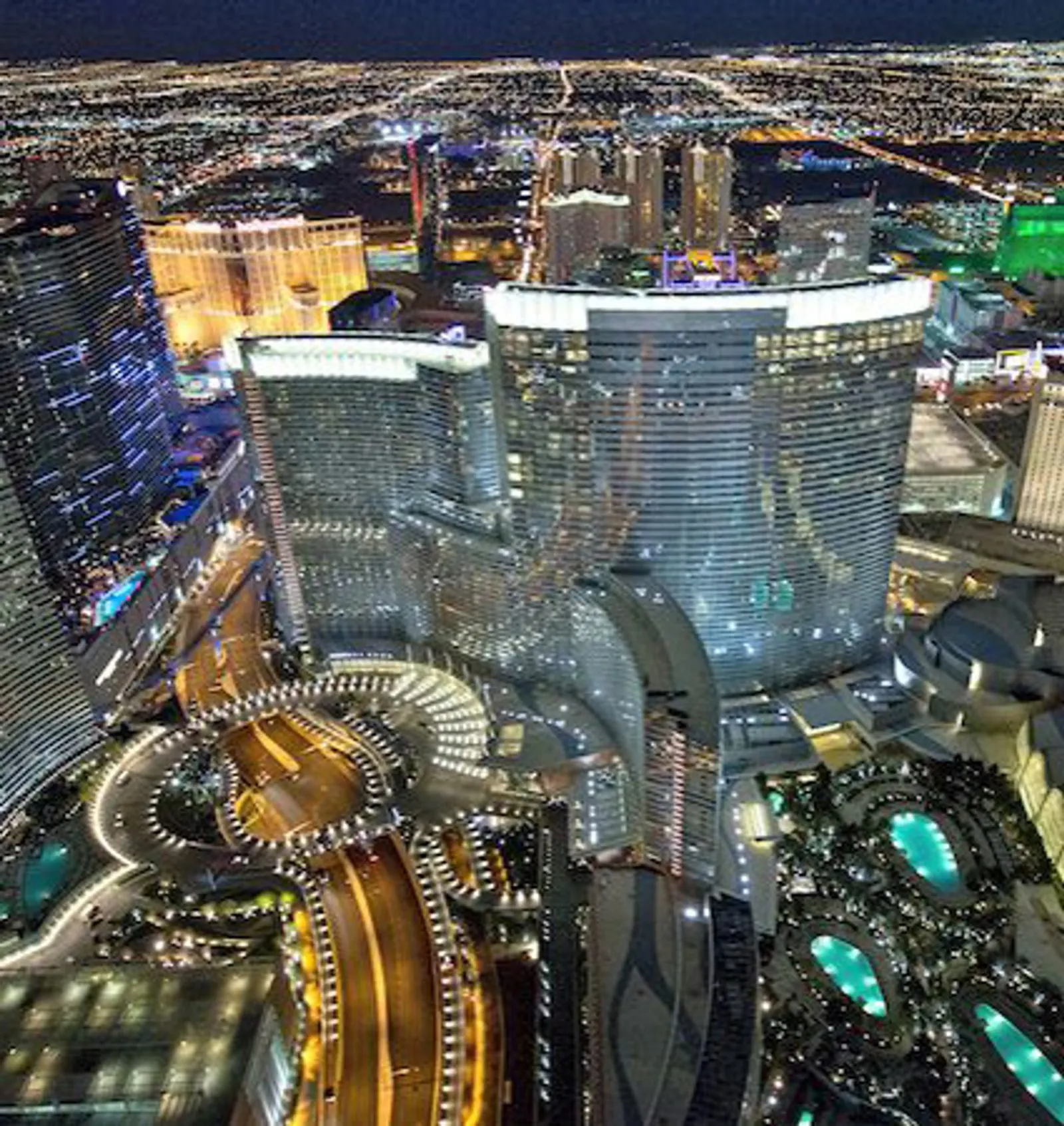 The Sphere glowing blue at night from the air