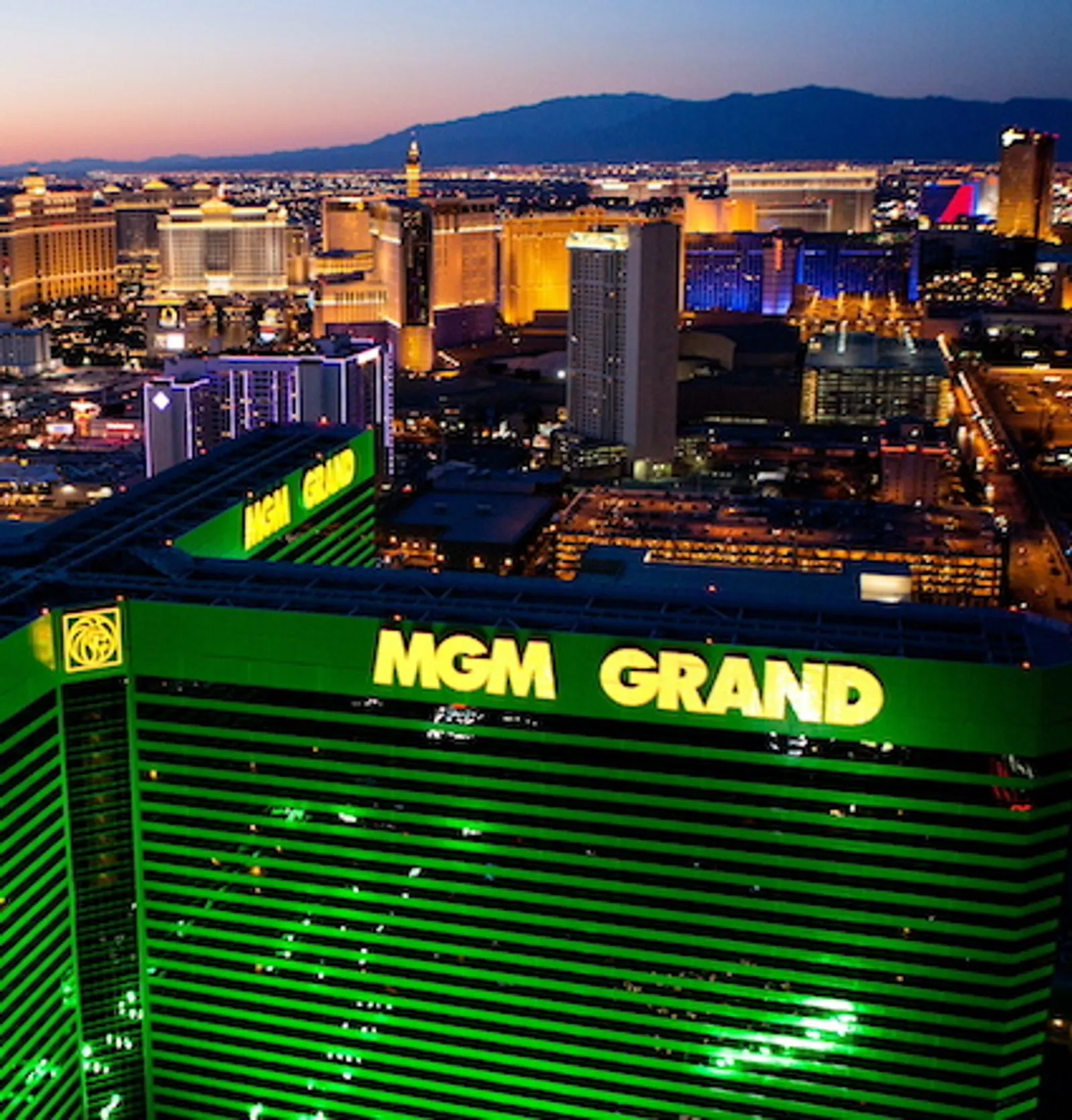 MGM Grand lit green at night from the helicopter